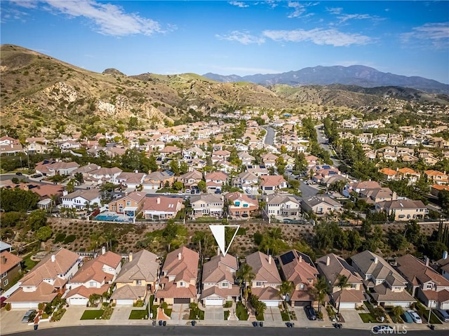 birds eye view of property with a residential view and a mountain view