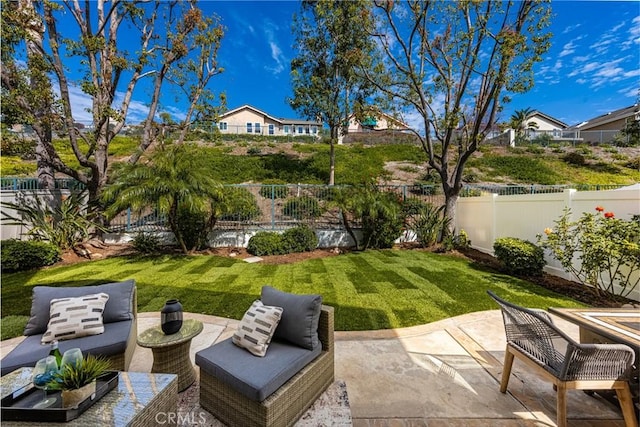 view of yard with a patio area, outdoor lounge area, and a fenced backyard