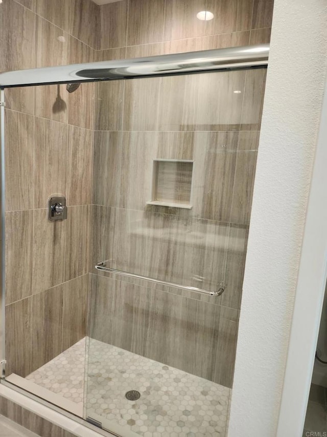 bathroom featuring walk in shower