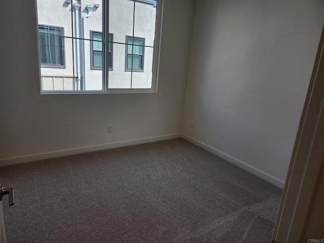 empty room featuring carpet flooring