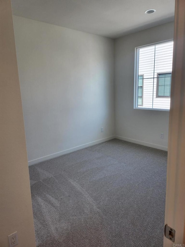 view of carpeted spare room