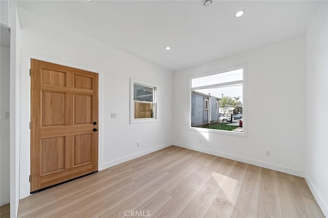 entrance foyer with light hardwood / wood-style flooring