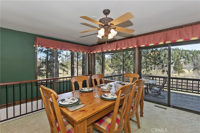 sunroom / solarium featuring ceiling fan and visible vents