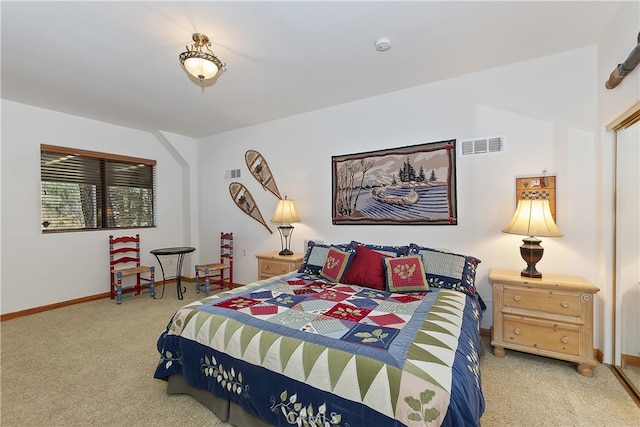 bedroom featuring visible vents, baseboards, and light colored carpet