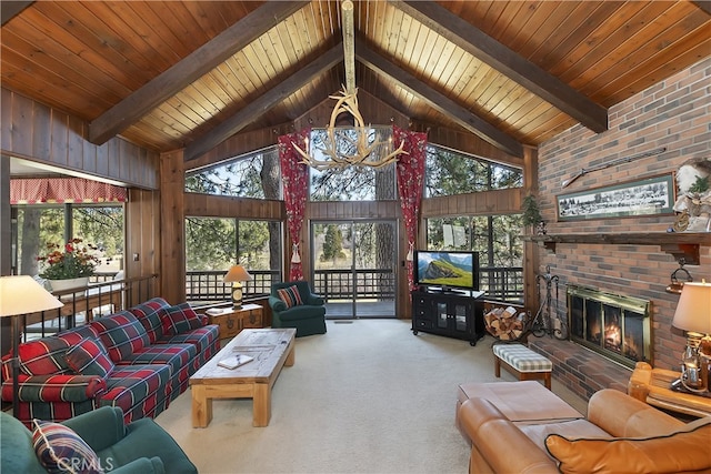 carpeted living area featuring high vaulted ceiling, beam ceiling, a chandelier, wood walls, and a brick fireplace