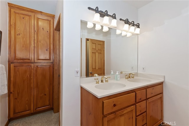 full bathroom featuring double vanity and a sink