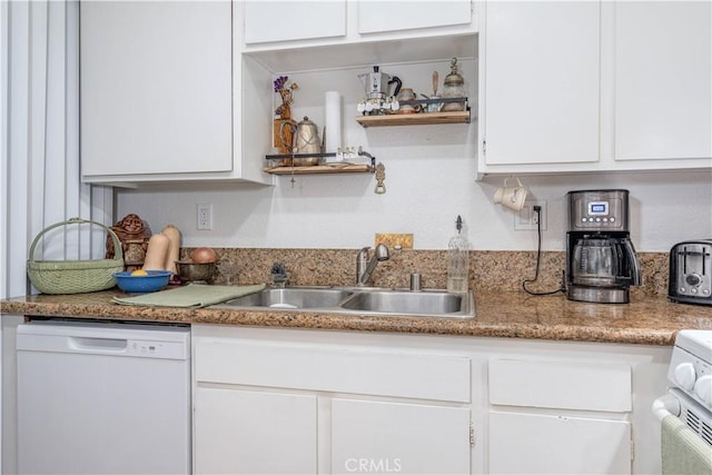 kitchen with white appliances, white cabinets, a sink, and open shelves