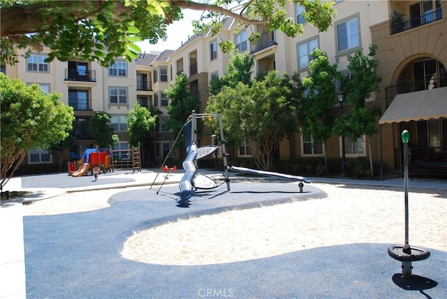 view of home's community featuring playground community