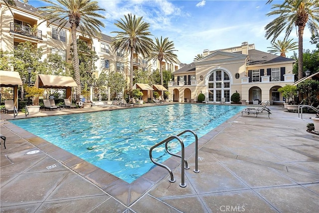 community pool with a patio