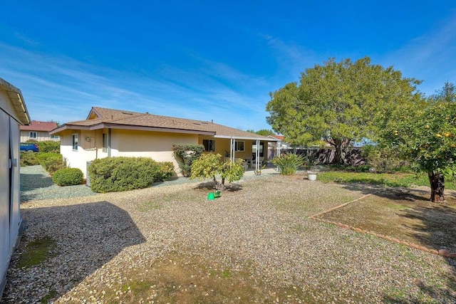 rear view of property featuring a patio area