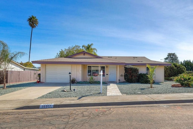 ranch-style house featuring a garage