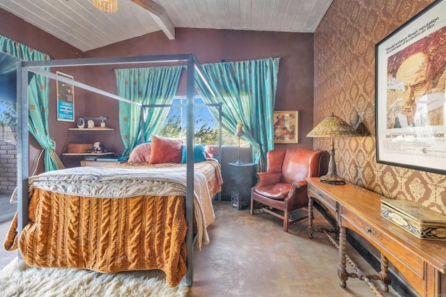 bedroom with concrete floors and vaulted ceiling with beams