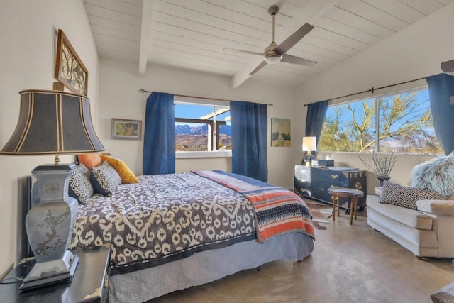 bedroom with ceiling fan, lofted ceiling with beams, concrete flooring, and multiple windows