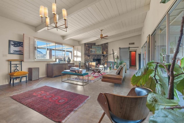 living room featuring lofted ceiling with beams, a stone fireplace, ceiling fan with notable chandelier, wooden ceiling, and a barn door