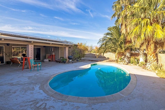 view of swimming pool featuring a patio