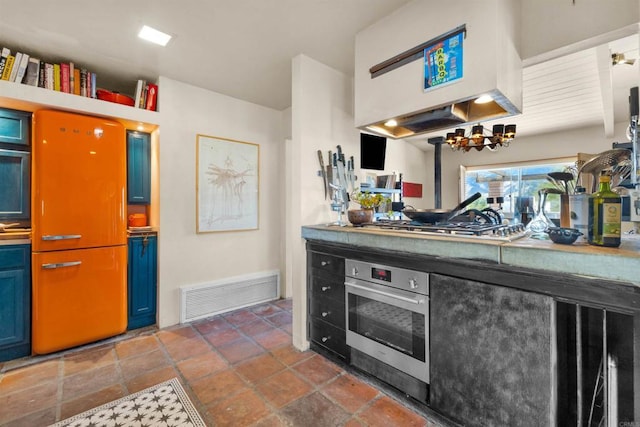 interior space featuring range hood and stainless steel appliances