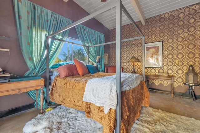 bedroom with vaulted ceiling with beams and concrete floors