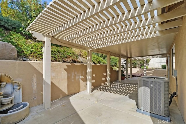 view of patio / terrace with a pergola and cooling unit