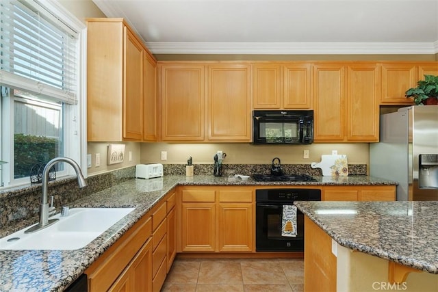 kitchen featuring sink, crown molding, black appliances, and stone countertops