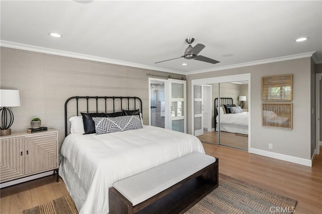 bedroom featuring baseboards, ornamental molding, wood finished floors, and recessed lighting