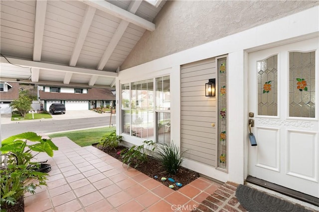 doorway to property with a garage