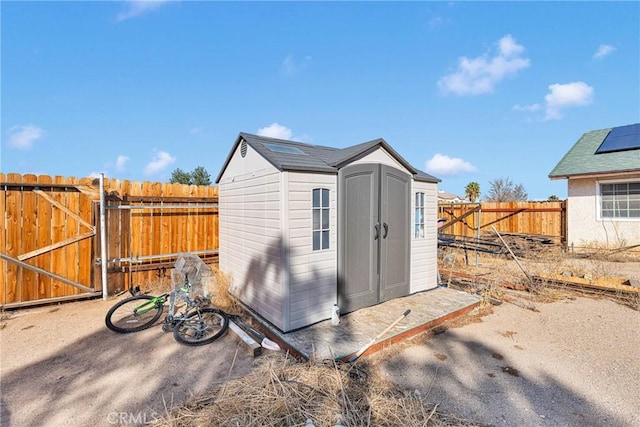 view of shed with a fenced backyard