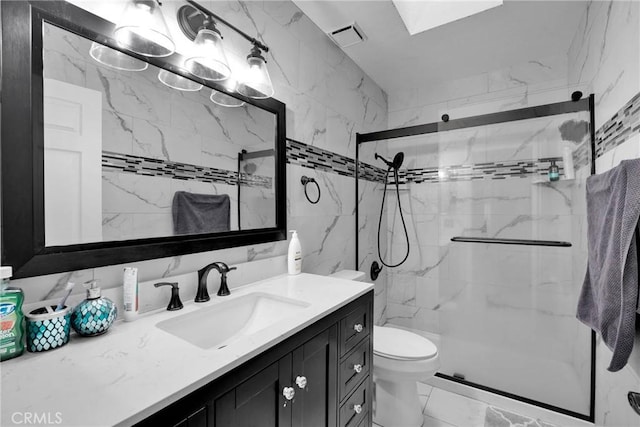 full bath featuring visible vents, marble finish floor, tile walls, a stall shower, and vanity