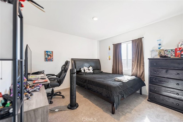 bedroom with baseboards and carpet floors