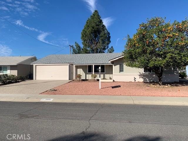 single story home with an attached garage and driveway