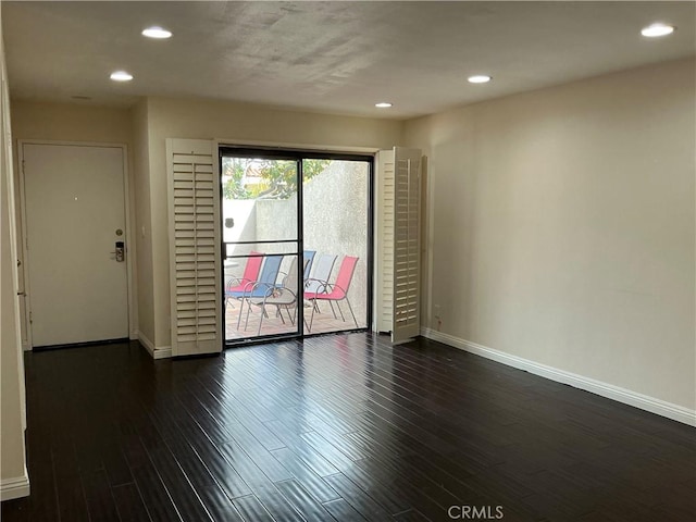 unfurnished room featuring recessed lighting, baseboards, and dark wood-style floors