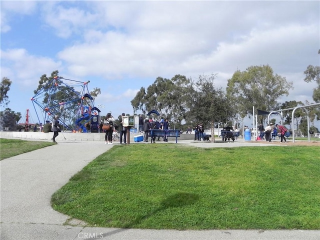 view of community with playground community and a yard