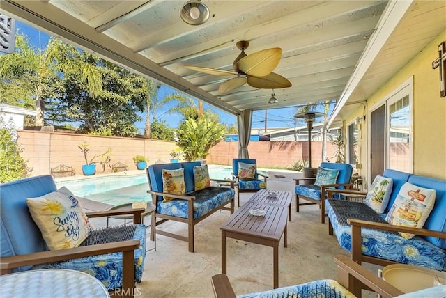 view of patio / terrace featuring an outdoor hangout area, ceiling fan, and a fenced in pool