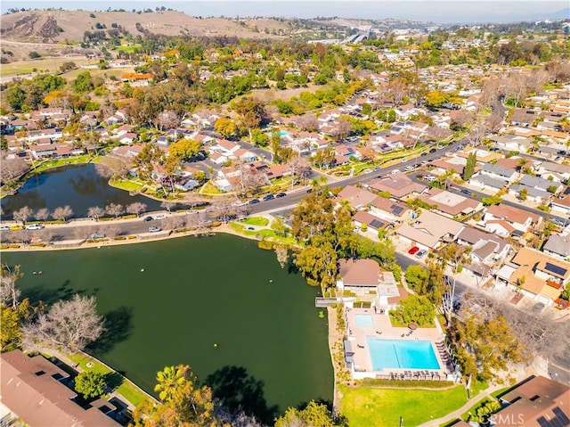 aerial view with a water view and a residential view