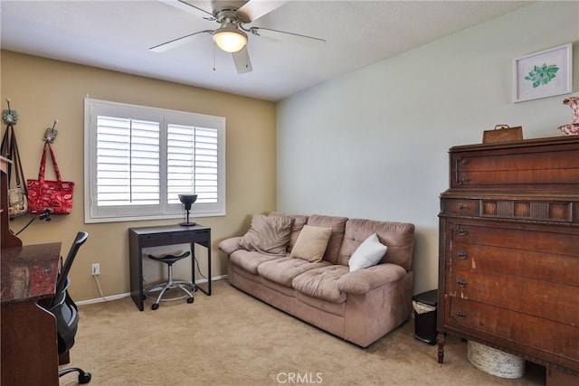 home office with ceiling fan and light colored carpet