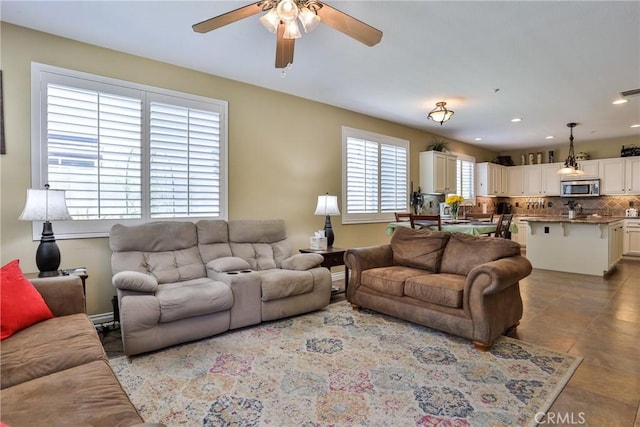 living room with ceiling fan