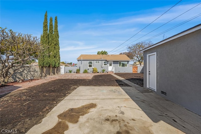 exterior space with fence private yard and a patio