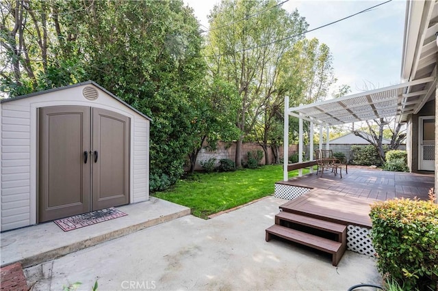 view of patio with a deck, a pergola, and a storage unit