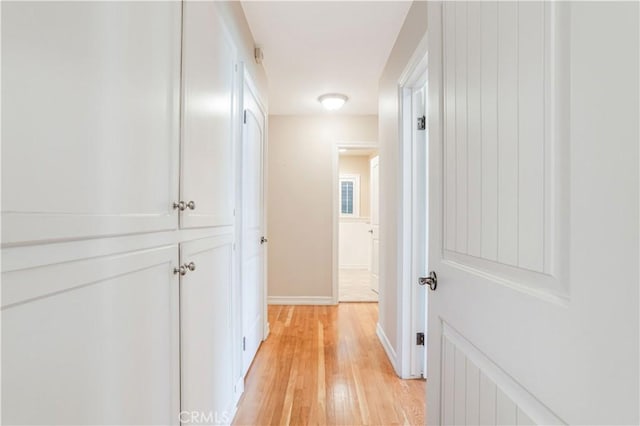 hallway with light wood-type flooring