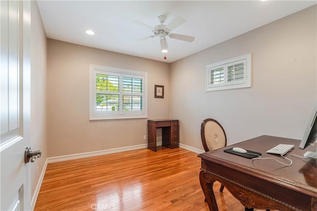 office area with ceiling fan and light hardwood / wood-style flooring