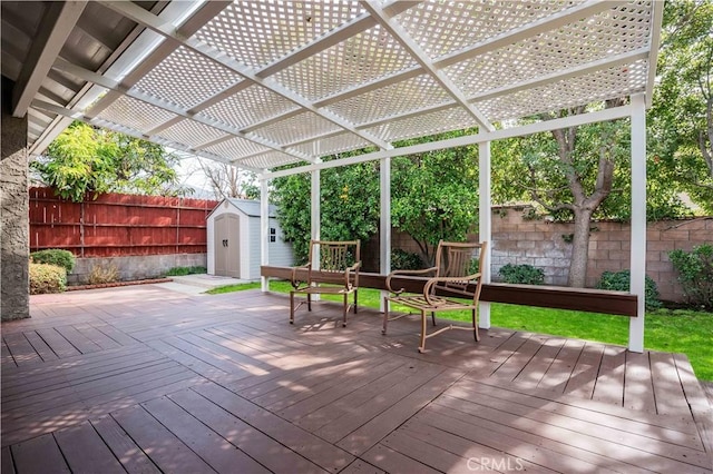 deck with a pergola and a storage shed