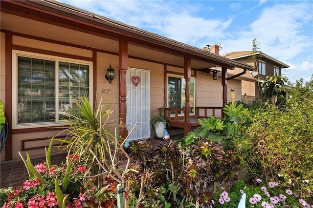 entrance to property with a porch