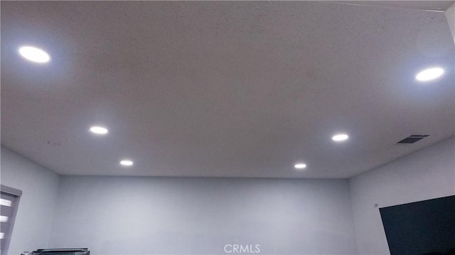 room details with visible vents and recessed lighting