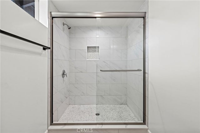 full bathroom with a shower stall