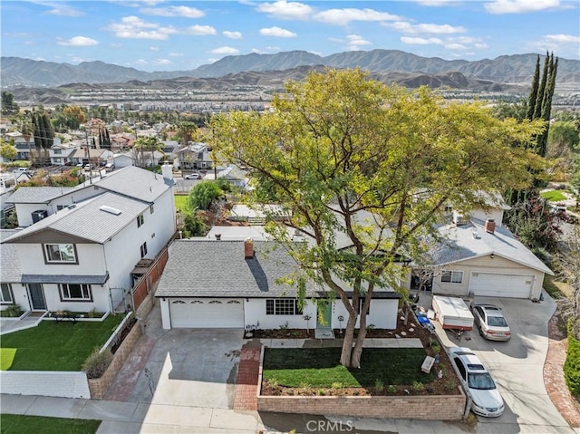 drone / aerial view with a residential view and a mountain view