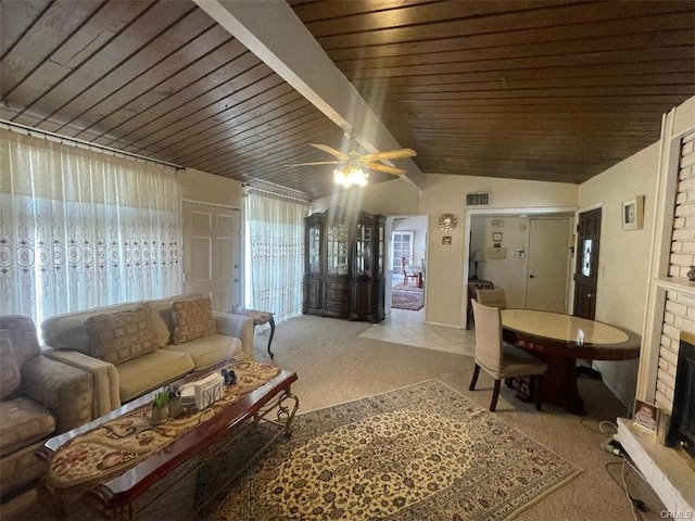 living room featuring a fireplace, lofted ceiling, visible vents, wood ceiling, and light carpet