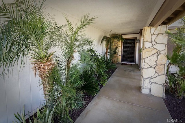 property entrance with stone siding