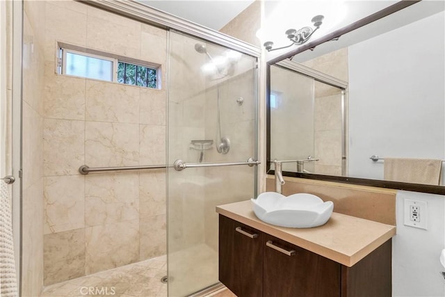 full bathroom featuring a stall shower and vanity