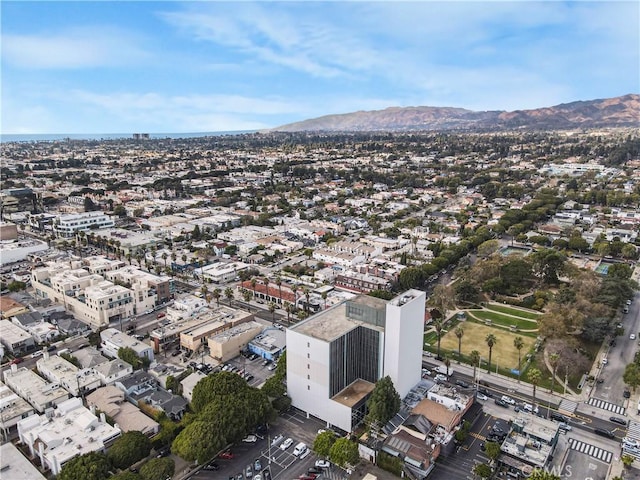 bird's eye view with a mountain view and a city view