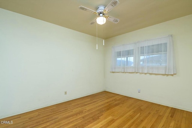 unfurnished room with ceiling fan and light hardwood / wood-style floors