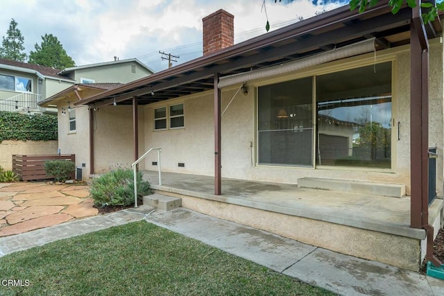 back of house featuring a patio area